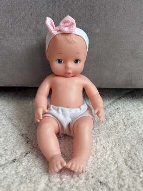 Goldberger Baby's First 10" All Vinyl Baby Doll with Pink Bow Headband